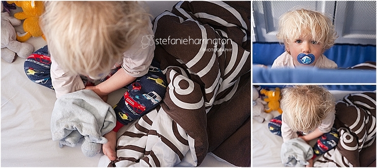 Adorable toddler boy with white blond hair is waking up in his portable crib.