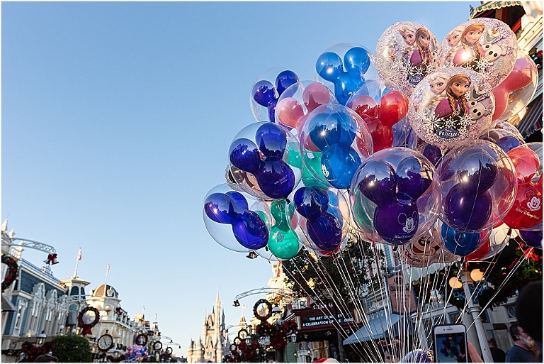 Mickey balloons and the Magic Kingdom castle include Disney World tips and tricks by travel photographer Stefanie Harrington