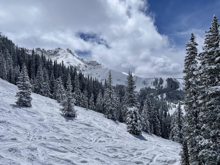 View of Prospect Bowl with blue sky, sunshine and clouds when visiting Telluride with kids